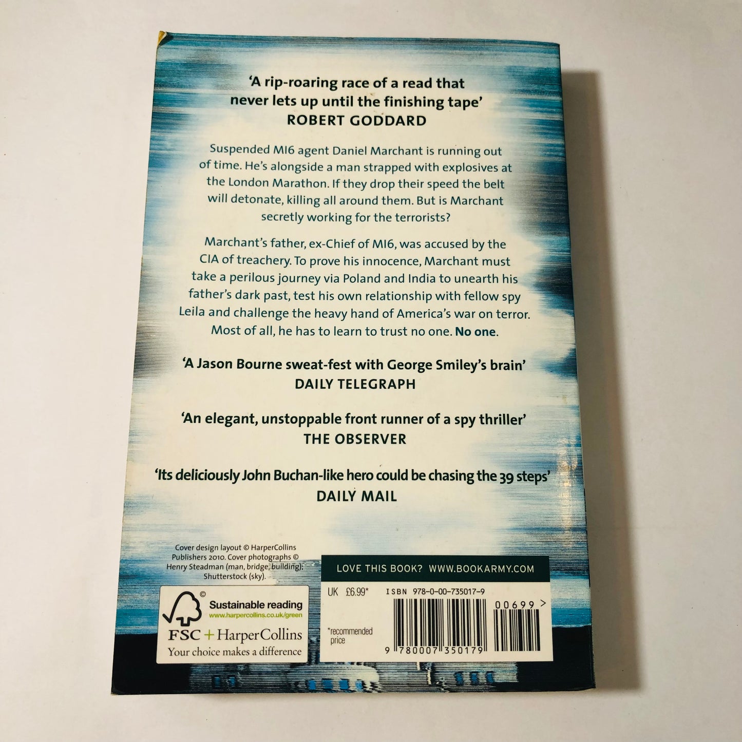 Back cover of Dead Spy Running by Jon Stock paperback book with text and a barcode on a light gray background