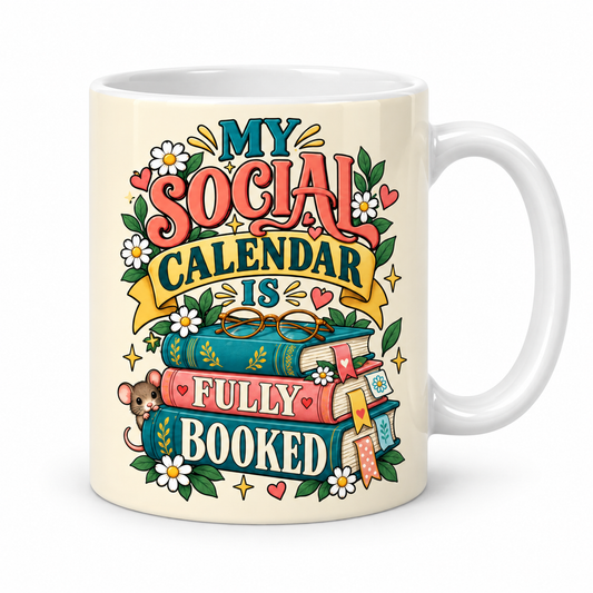 A white ceramic mug featuring a colorful retro-style graphic that reads 'MY SOCIAL CALENDAR IS FULLY BOOKED' with illustrated books, flowers, hearts, stars, and a small mouse.