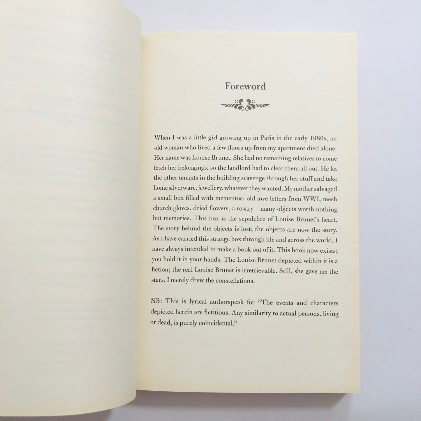 Open book showing a foreword on a light background
