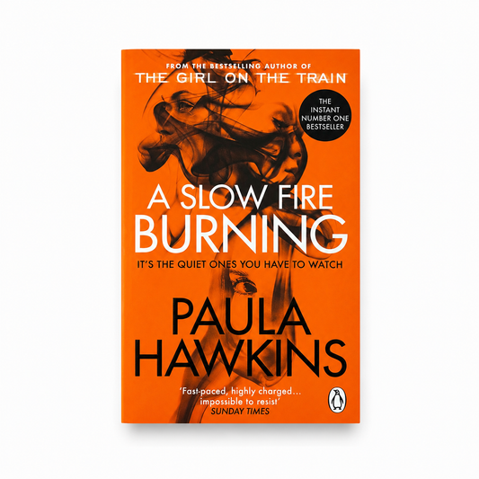 A book cover for 'A Slow Fire Burning' by Paula Hawkins, featuring a bold orange background with black and white typography and an abstract illustration of a woman's face and hair. The Penguin logo is visible at the bottom right.