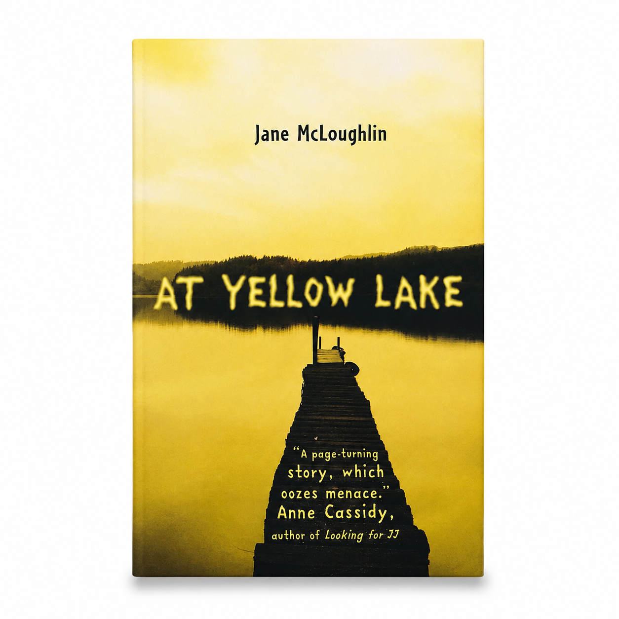 The book cover of 'At Yellow Lake' by Jane McLoughlin, featuring a yellow-toned landscape with a lighthouse silhouette and title text, shown against a plain white background.