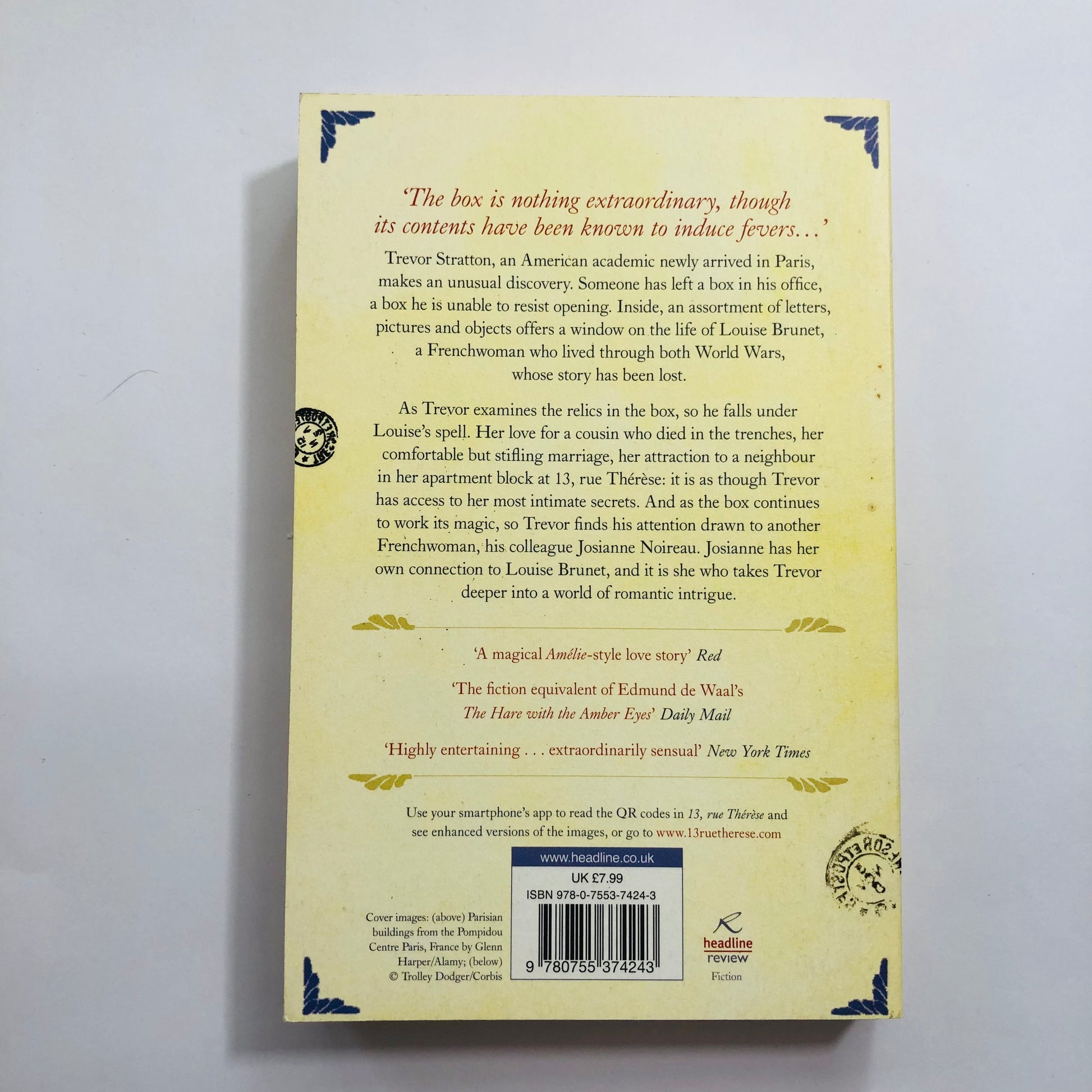 Close-up of the back cover of 13, Rue Therese highlighting quotes about its innovative use of photographs and its captivating mystery.