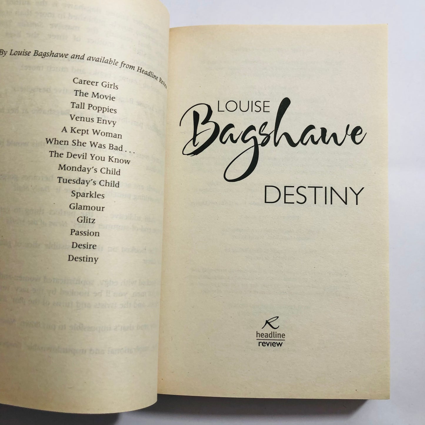 Open book with text and author's name on a white background