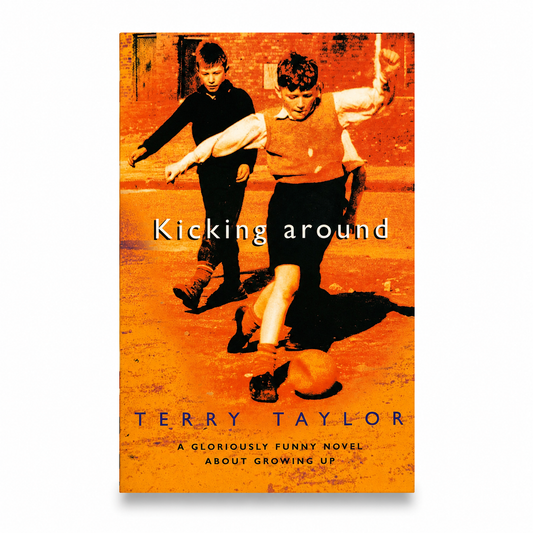 Kicking Around by Terry Taylor paperback book centred on a pure white background with a soft shadow. Orange-toned cover showing two boys playing football. Very Good used condition with minor age-related wear.