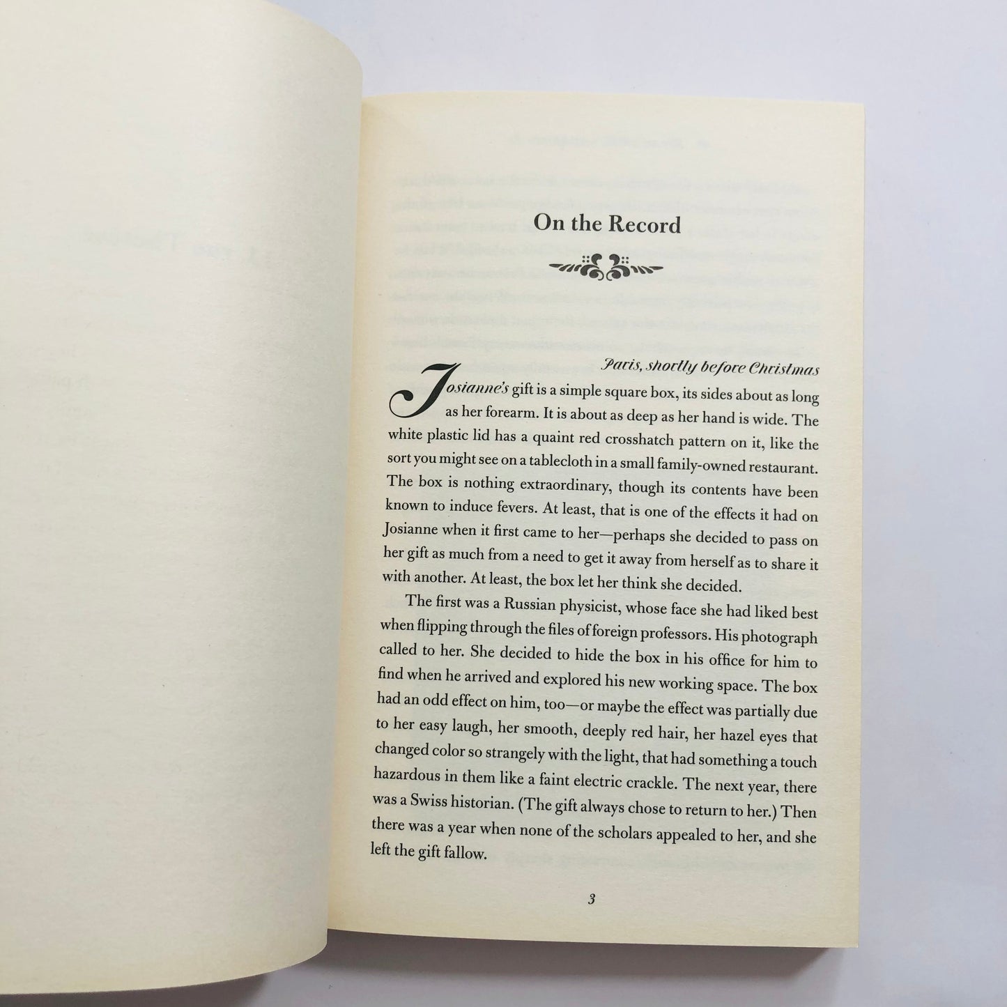 Open book with text on a white background