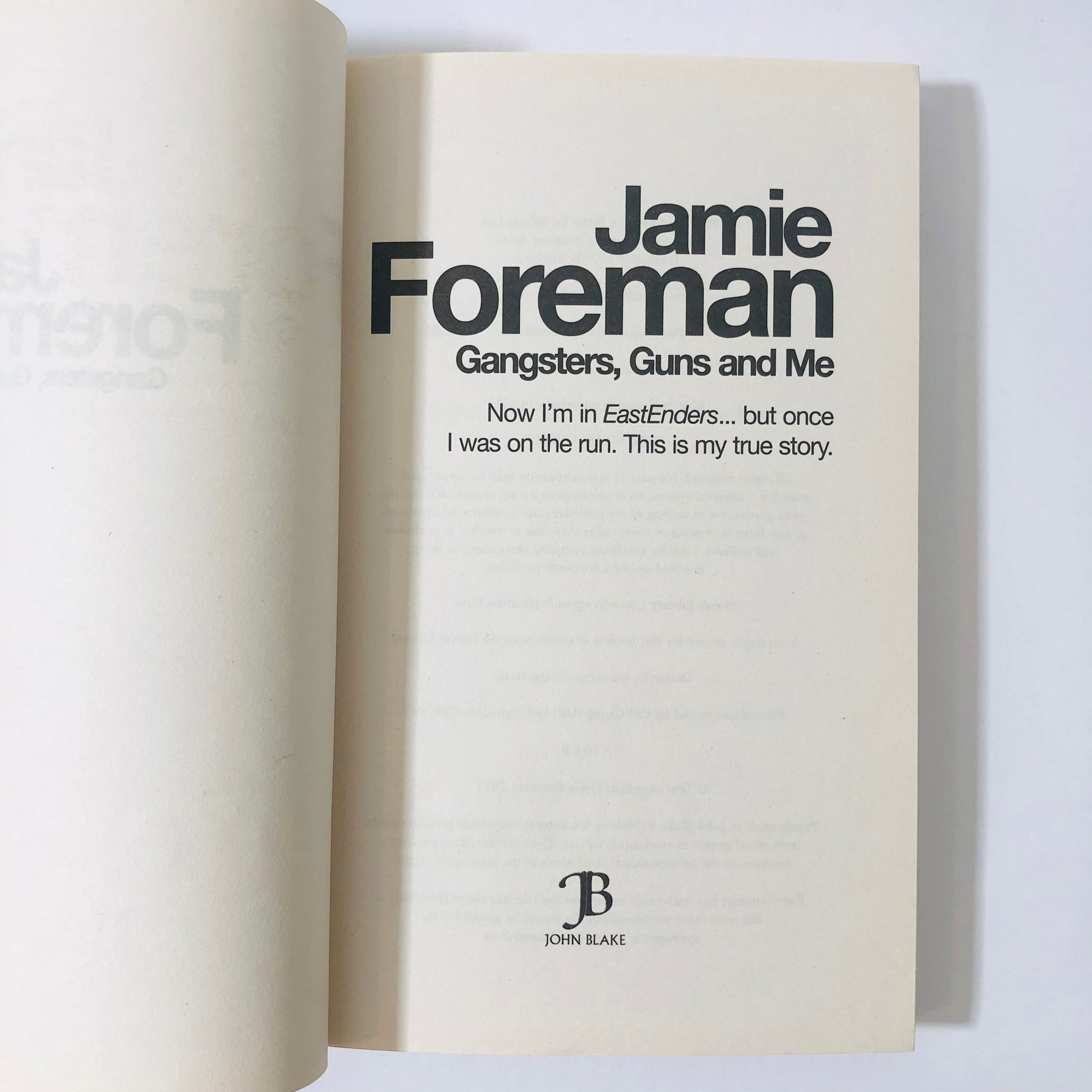 Book titled 'Gangsters, Guns and Me' by Jamie Foreman on a white background