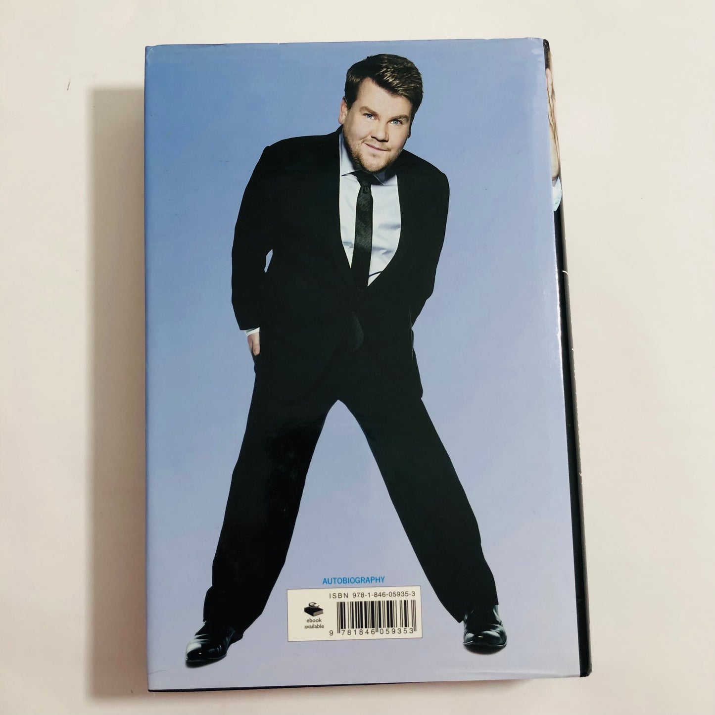 Book cover with a person in formal attire on a blue background