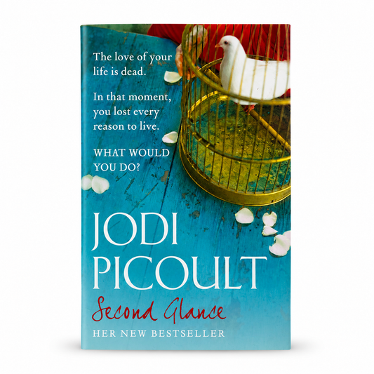 Second Glance by Jodi Picoult paperback book front cover. Very good used condition. Novel featuring a blue cover with a white dove in a birdcage and white flower petals. Available from BookBuddies.