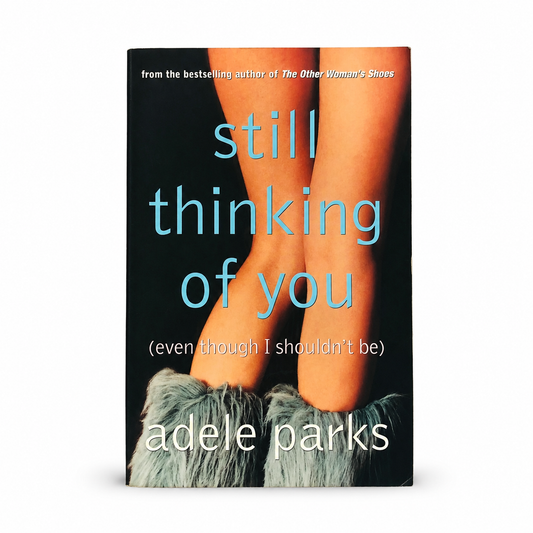 Front cover of Still Thinking of You by Adele Parks, paperback contemporary women's fiction novel in Very Good condition featuring a black cover with blue title text and illustrated legs in fluffy boots.