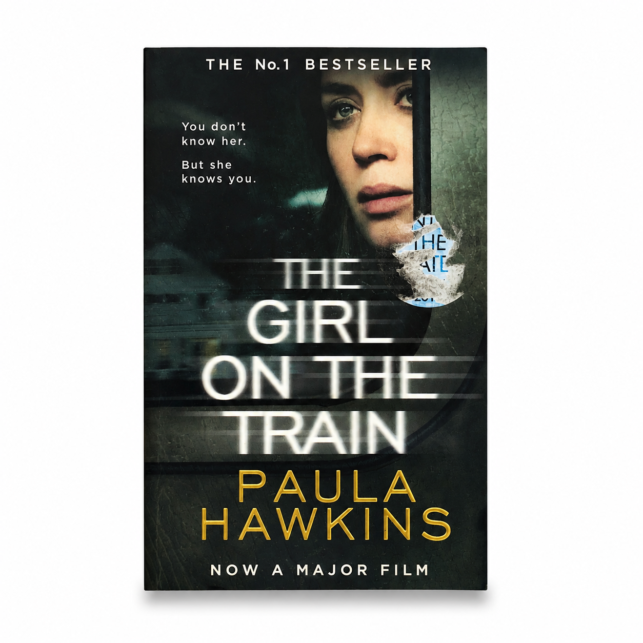 The Girl on the Train by Paula Hawkins paperback book front cover.