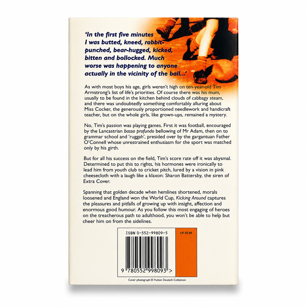 Back cover of Kicking Around by Terry Taylor paperback centred on a pure white background with a soft shadow. Displays the book synopsis and barcode. Very Good used condition with some age-related page yellowing noted.