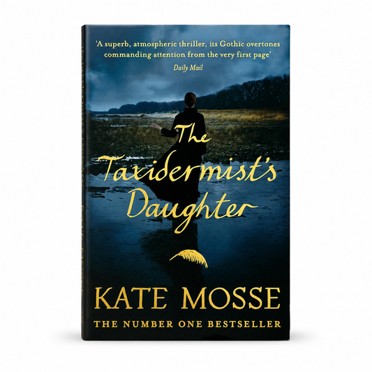 Front cover of The Taxidermist's Daughter by Kate Mosse, paperback gothic historical mystery featuring a lone figure standing in marshland beneath stormy skies with gold lettering.